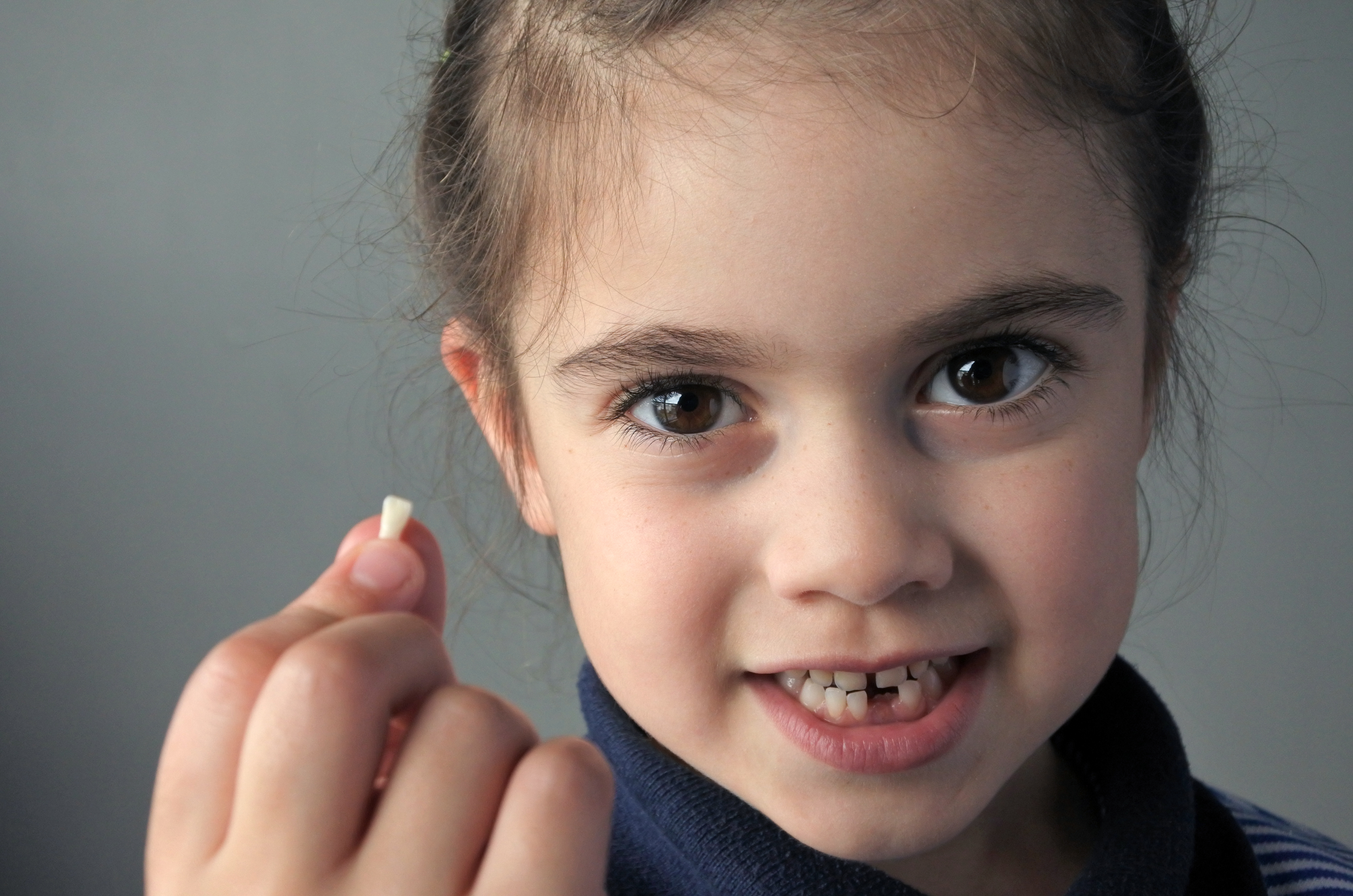 Kid shows off lost tooth